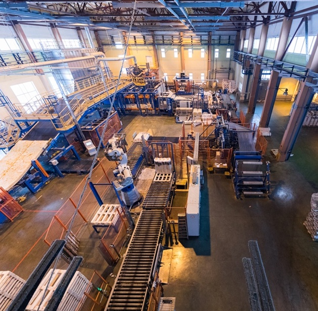 Fiberglass production industry equipment at manufacture background